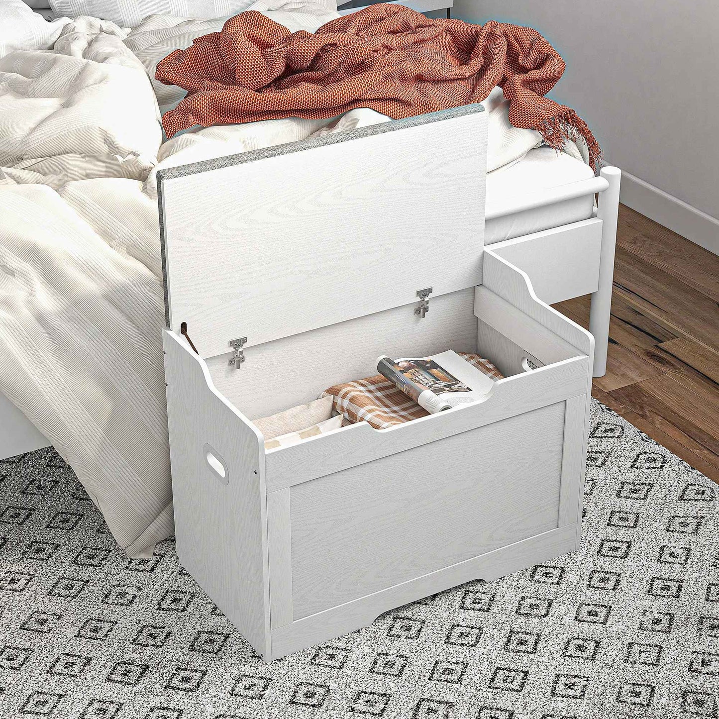 banc coffre de rangement dans l'entrée d'une chambre avec coussins et jetés 