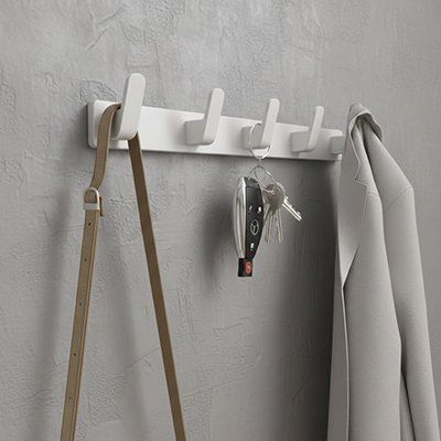 Patère porte manteau  blanc sur un mur gris